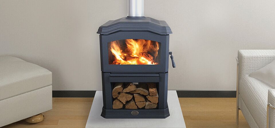 A Kemlan C24 wood burning stove filled with logs, one of the best wood heaters for autumn creating a cosy warm home atmosphere