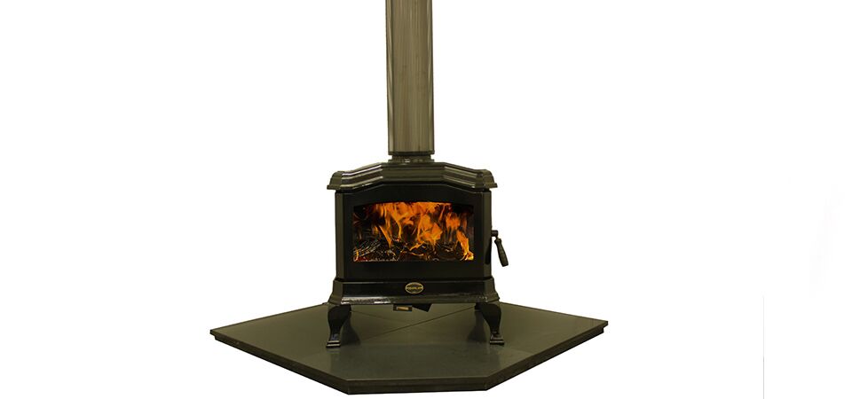 Black Kemlan C24 wood burning stove on a stand, one of the best wood heaters for autumn providing efficient home warmth