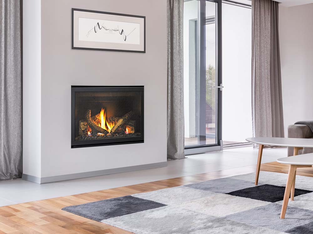 Modern gas log fires for homes with a Heat & Glo 5X fireplace installed in a cozy living room beside a white couch