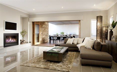 A spacious living room with a Heatmaster Enviro 5, one of the best gas fireplaces for autumn warmth and comfortable relaxation