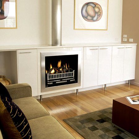 Modern gas log fires for homes in a stylish living room with a cosy couch, creating warmth and elegant ambiance