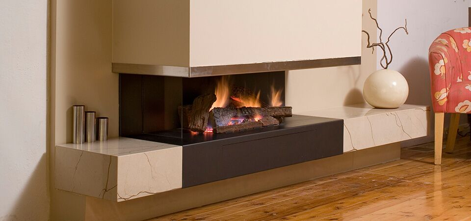 Modern gas log fires for homes with a Horizon Cantilever Fire and cosy seating, adding warmth and style to the living space