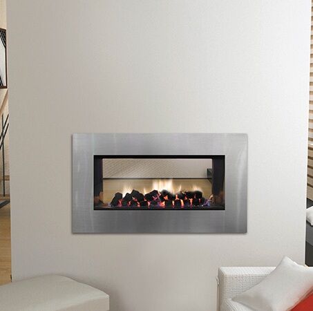 A Horizon Low Line Double Sided Fireplace installed in a white wall, one of the best gas log heaters for autumn