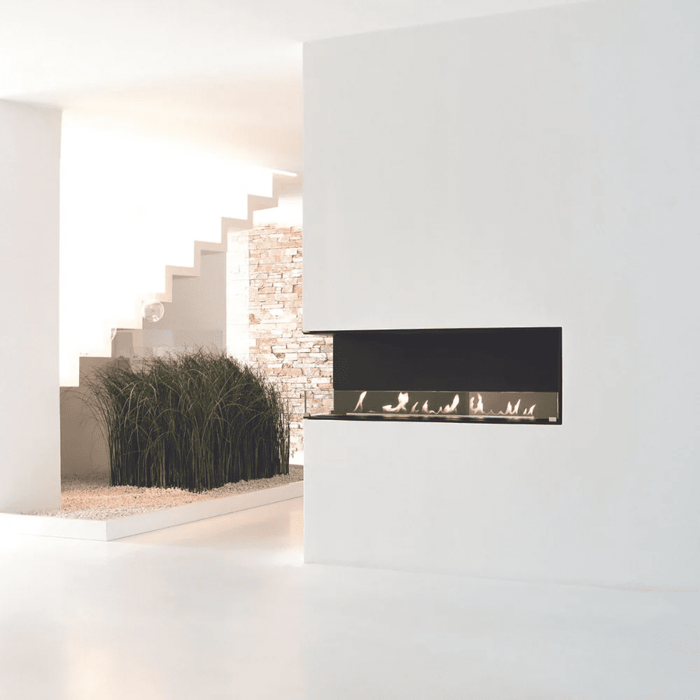 Energy-efficient wood heaters Melbourne with a modern Net Zero Fireplace Insert in a white room, offering 8–16 hour burn times