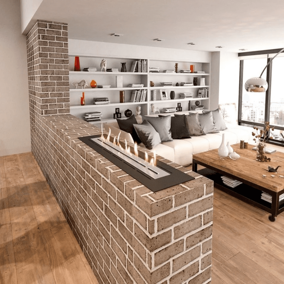 A cosy living room featuring a brick wall, a fireplace, and a Decoflame Net Zero Fireplace Inserts for modern ambiance