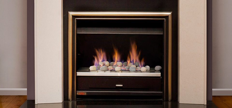 Jetmaster Topaz Series fireplace with a black and white mantle, one of the best fireplaces for autumn warmth and cosy elegance