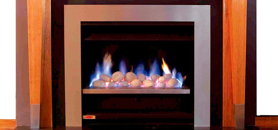Jetmaster Topaz Series with a wood frame, one of the best fireplaces for autumn warmth creating a cosy room ambiance