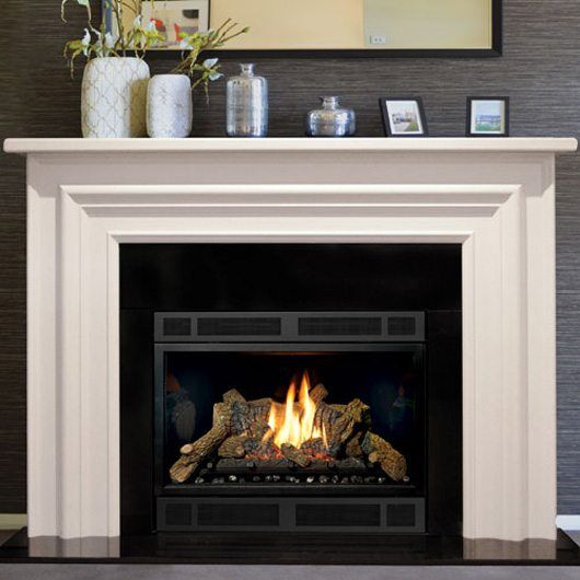 A white fireplace with a black Real Flame Bouvier mantelpiece, adding warmth and style with modern gas log fires for homes