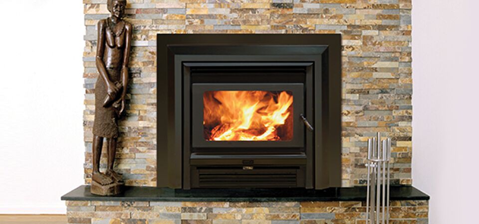 Kemlan Super Nova fireplace beside a statue, creating a warm cosy ambiance, one of the best wood heaters for autumn