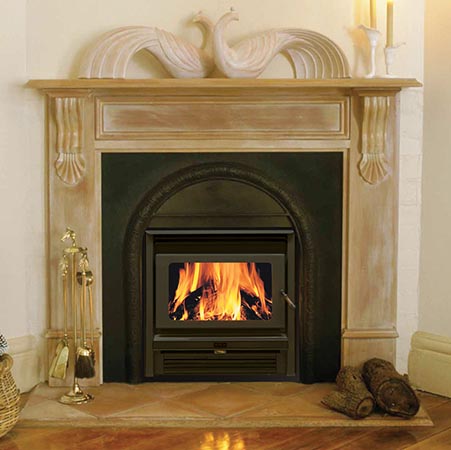 A Kemlan Super Nova wood burning stove in a cosy corner beside a basket, one of the best wood heaters for autumn creating a warm indoor space