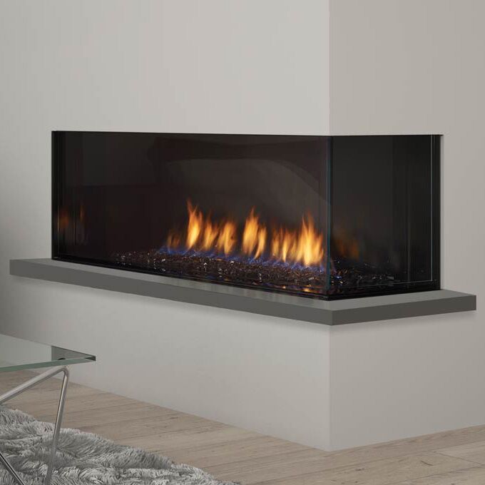 Contemporary gas fireplace with a glass wall, featuring the Regency City Series Chicago Corner 40RE near a modern glass table