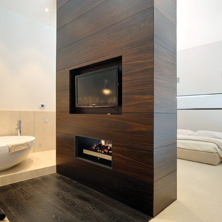Stylish bathroom with a Real Flame Double Vision fireplace and TV, showing modern gas log fires for homes with luxury design