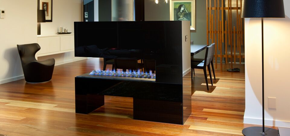Modern gas log fires for homes with a Horizon 3-sided fireplace creating a warm and cosy living room atmosphere