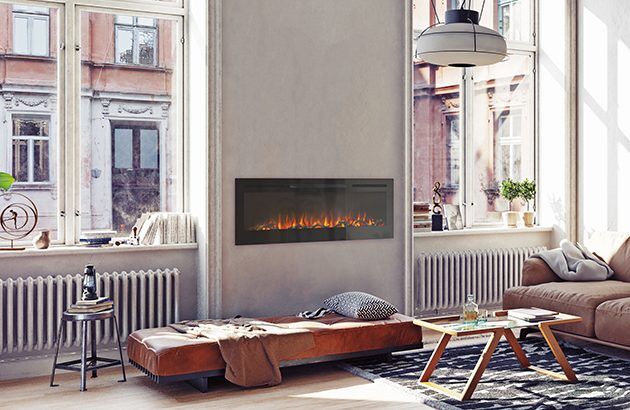A simple living room with a VisionLINE Linear fireplace and comfortable couches