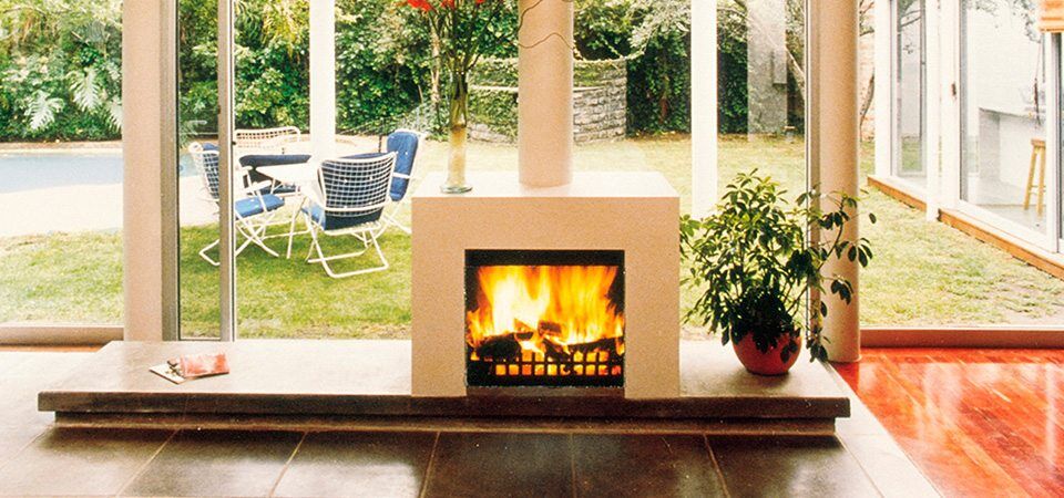 A modern Jetmaster freestanding glass-door fireplace providing cosy comfort, one of the best gas fireplaces for autumn warmth