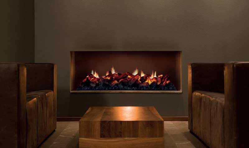 A Real Flame gas log fireplace in Melbourne, featuring a wood table and two chairs, creating a welcoming space