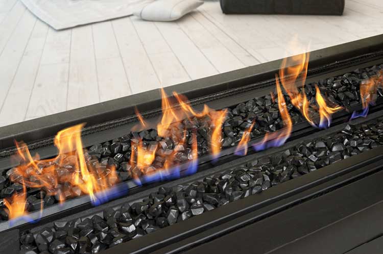 A black Real Flame Element 1800 DS Gas Fire featuring realistic flames, logs, and large black coals, creating a warm ambiance