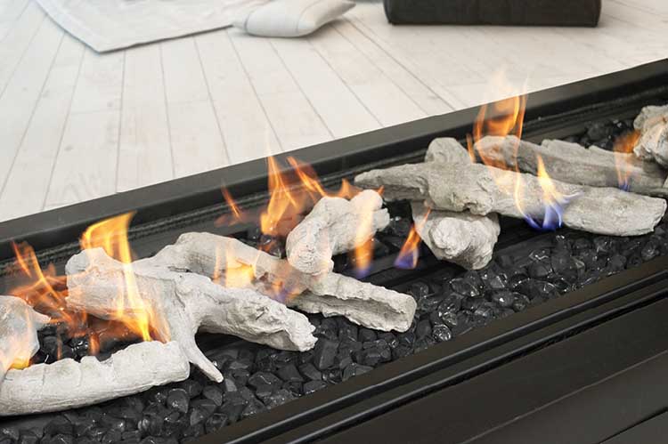 Element 1800 Media - Logs and Black Diamond 2 - LR fireplace with burning logs and flames, showcasing warmth and ambiance in a living space