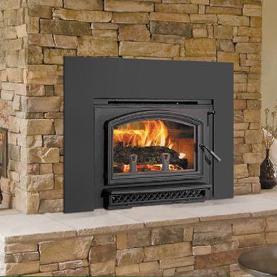 Traditional wood fireplaces Melbourne with a Quadra Fire Voyageur Grand stove in a brick wall creating cosy warmth and inviting home ambiance