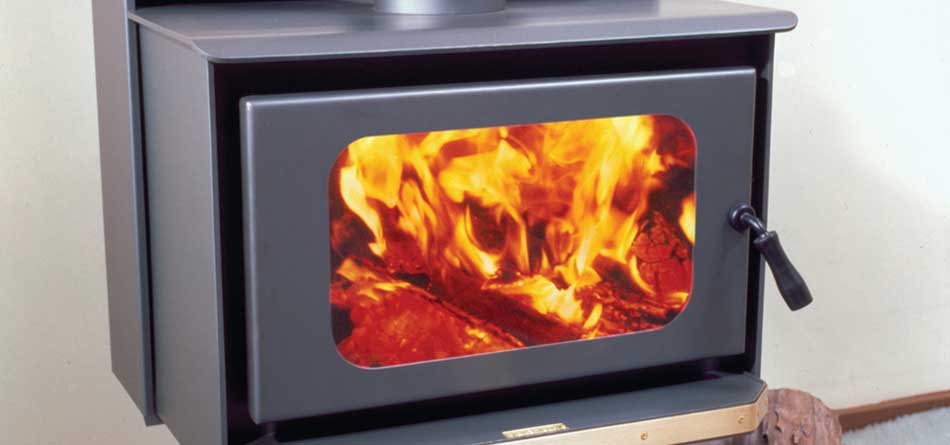 Kemlan Tempo wood burning stove with a bright fire inside, one of the best wood heaters for autumn adding warmth and cosy ambiance
