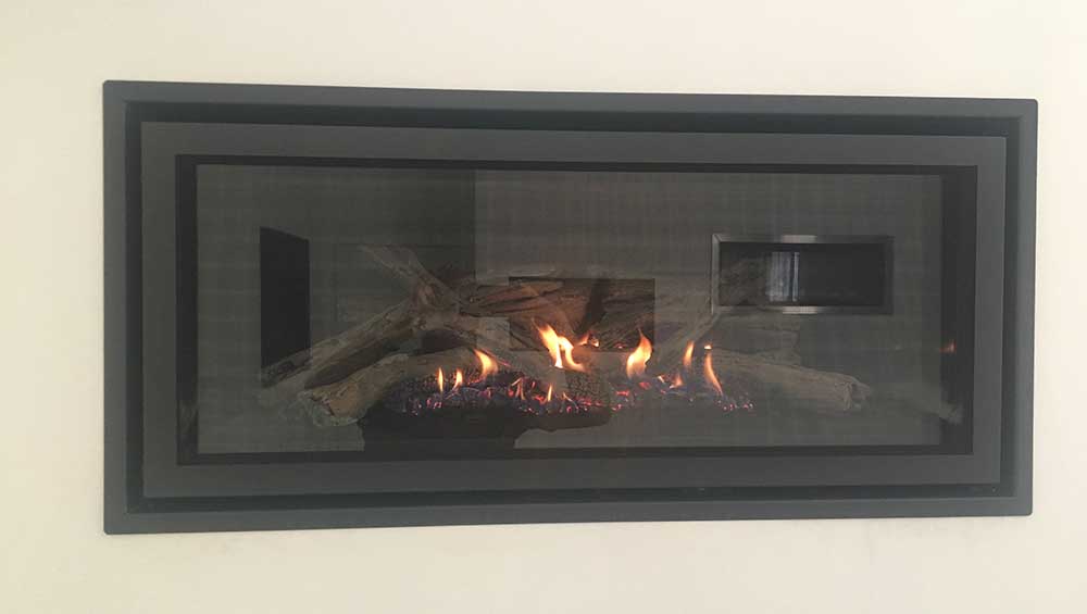 Regency GF900L with warm flickering flames in a sleek fireplace design, adding comfort and style with modern gas fireplaces for homes