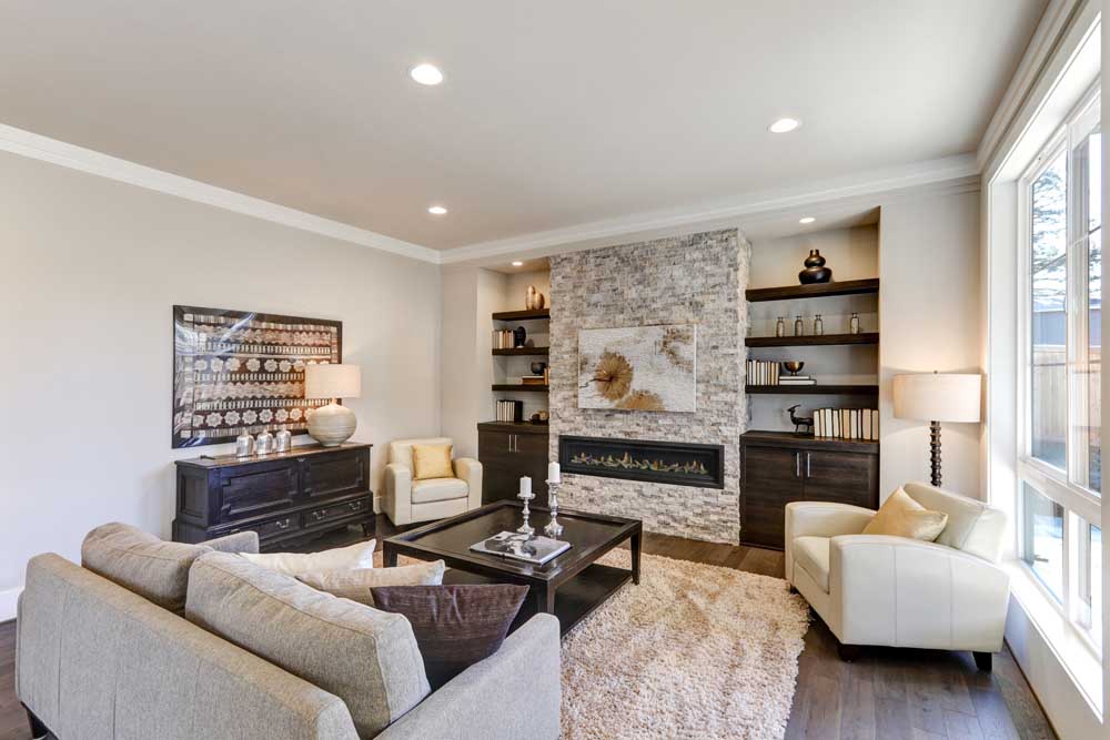A stylish living room in Melbourne with a Real Flame Element 1800 gas fire, complemented by inviting couches for a warm atmosphere