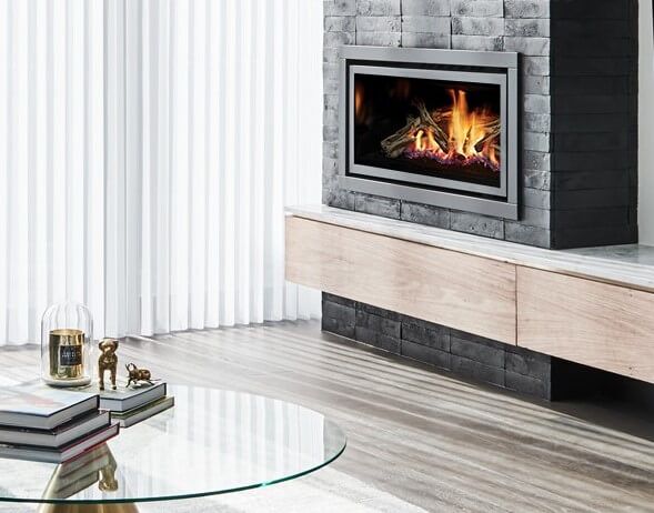 Modern gas fireplaces for home heating with a Regency GF950L Gas Fire design, paired with a sleek glass table for stylish comfort