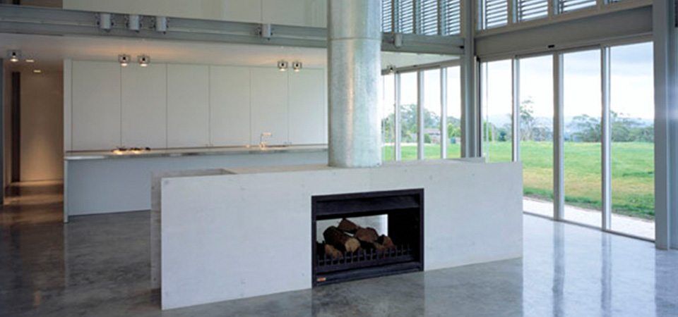 A modern kitchen with a Jetmaster Universal Double Sided fireplace offering cosy comfort, one of the best fireplaces for autumn warmth