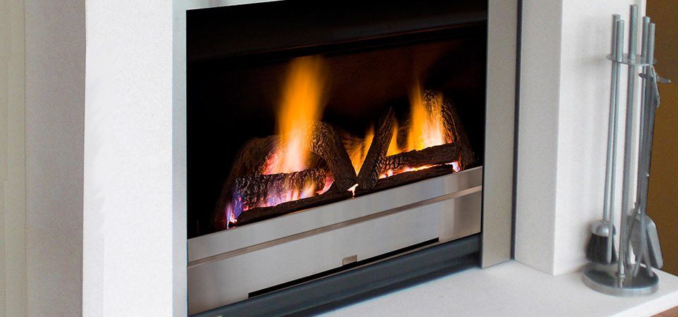 Jetmaster Ironbark Logs 850 gas fireplace with a glowing flame creating a cosy home ambiance, ideal for autumn warmth