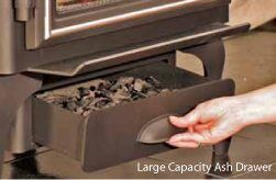 A person holding a Quadra-Fire 3100 Step Top Wood Fire stove, one of the best wood heaters for autumn home warmth