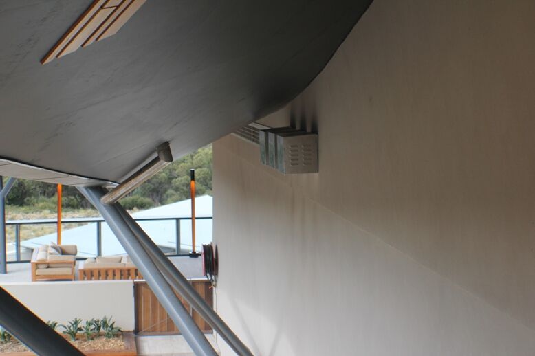 A home window with a Power Flue System providing efficient ventilation for modern gas log fires for homes
