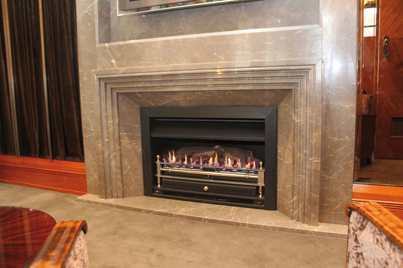 Modern gas log fires for homes with a sleek fireplace design and Power Flue System for efficient indoor ventilation