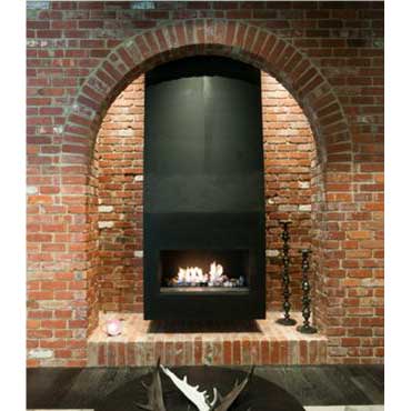 A Real Flame Power Flue built into a brick wall with an arched design, adding warmth and style to modern gas log fires for homes