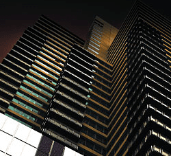A vibrant city building at night with warm lighting enhanced by Power Flue system and modern gas log fires for homes