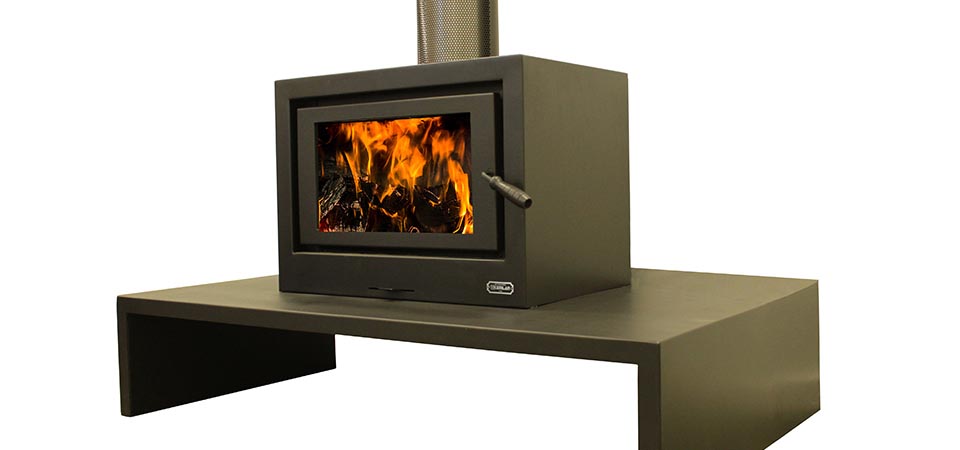 Kemlan See Through Cube wood burning stove on a stand, one of the best wood heaters for autumn with modern design and warmth