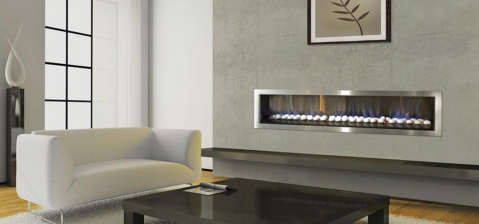 A modern Horizon Low Line inbuilt fireplace in a stylish living room with a white plush couch, one of the best gas log heaters for autumn comfort