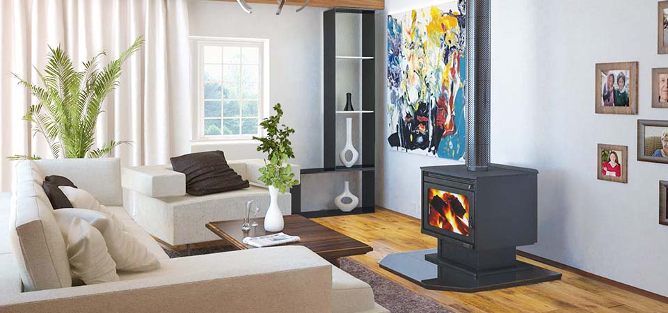 A modern living room with a plush sofa and Kemlan XL wood heater and warm decor, ideal for comfort and style—best wood heaters for autumn