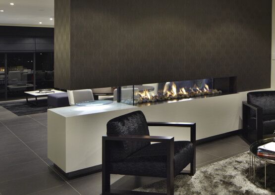 A stylish living room with a Real Flame Hybrid Gas Log Fire, one of the best gas fireplaces for autumn warmth and comfort