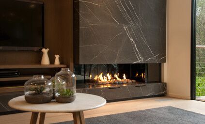 A modern living room with a Real Flame Hybrid Gas Log Fire, one of the best gas fireplaces for autumn warmth and comfort