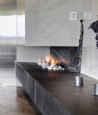 Modern Real Flame Hybrid Gas Log Fire with elegant sculpture, one of the best gas fireplaces for autumn warmth and style