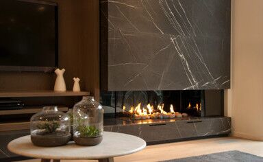 A modern living room with a Real Flame Hybrid Gas Log Fire, one of the best gas fireplaces for autumn warmth and comfort