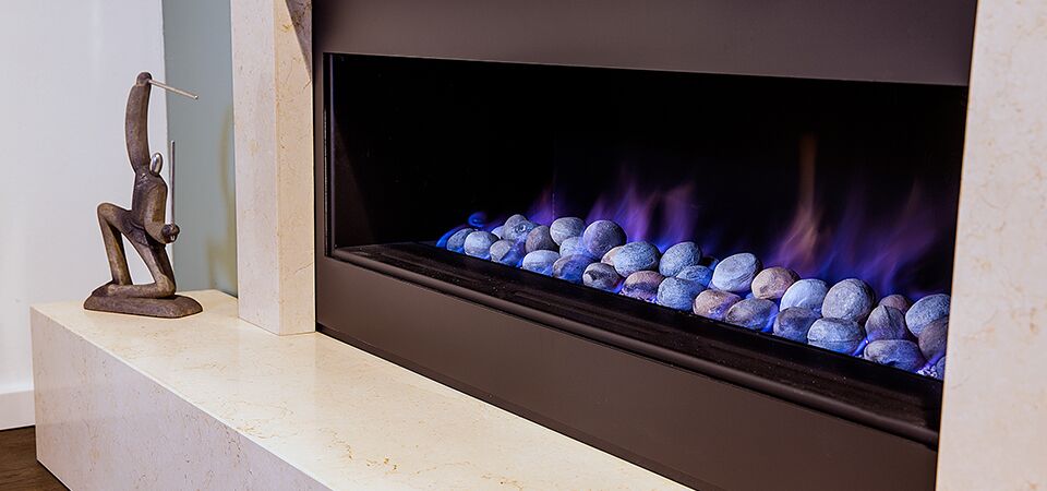 A cosy modern living room with a Horizon Low Line fireplace, one of the best gas log heaters for autumn comfort and warmth
