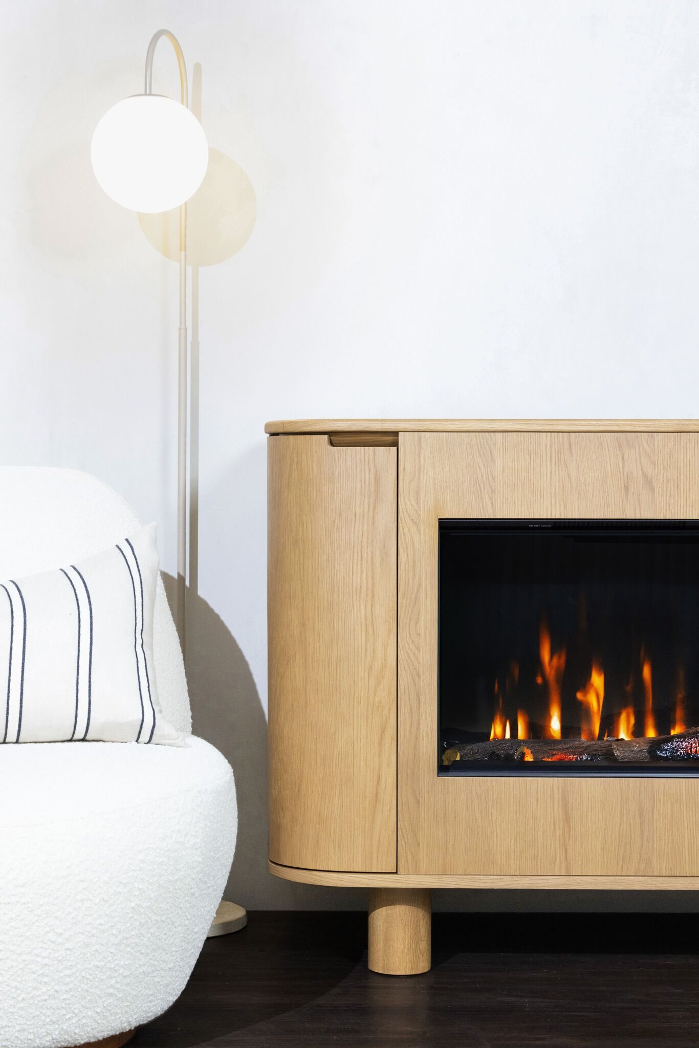 A modern EmberArc Ashton 210 electric fireplace featuring a sleek wood-burning stove design